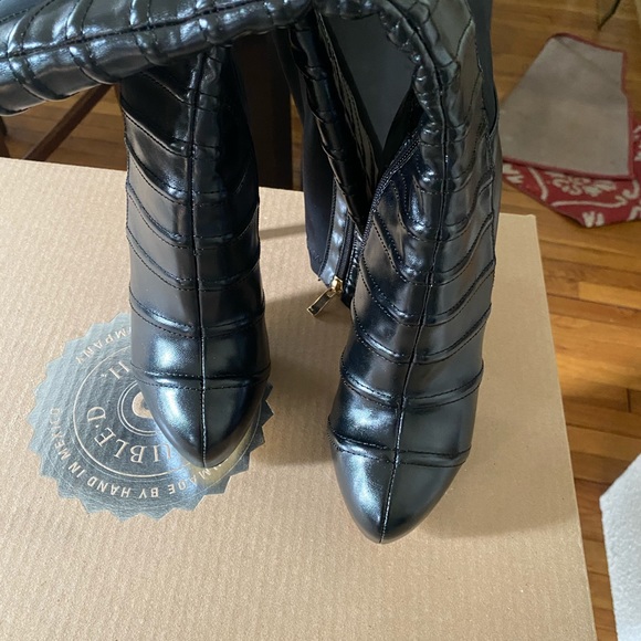 Black man made boots 4’. Never wore them. - Picture 1 of 4